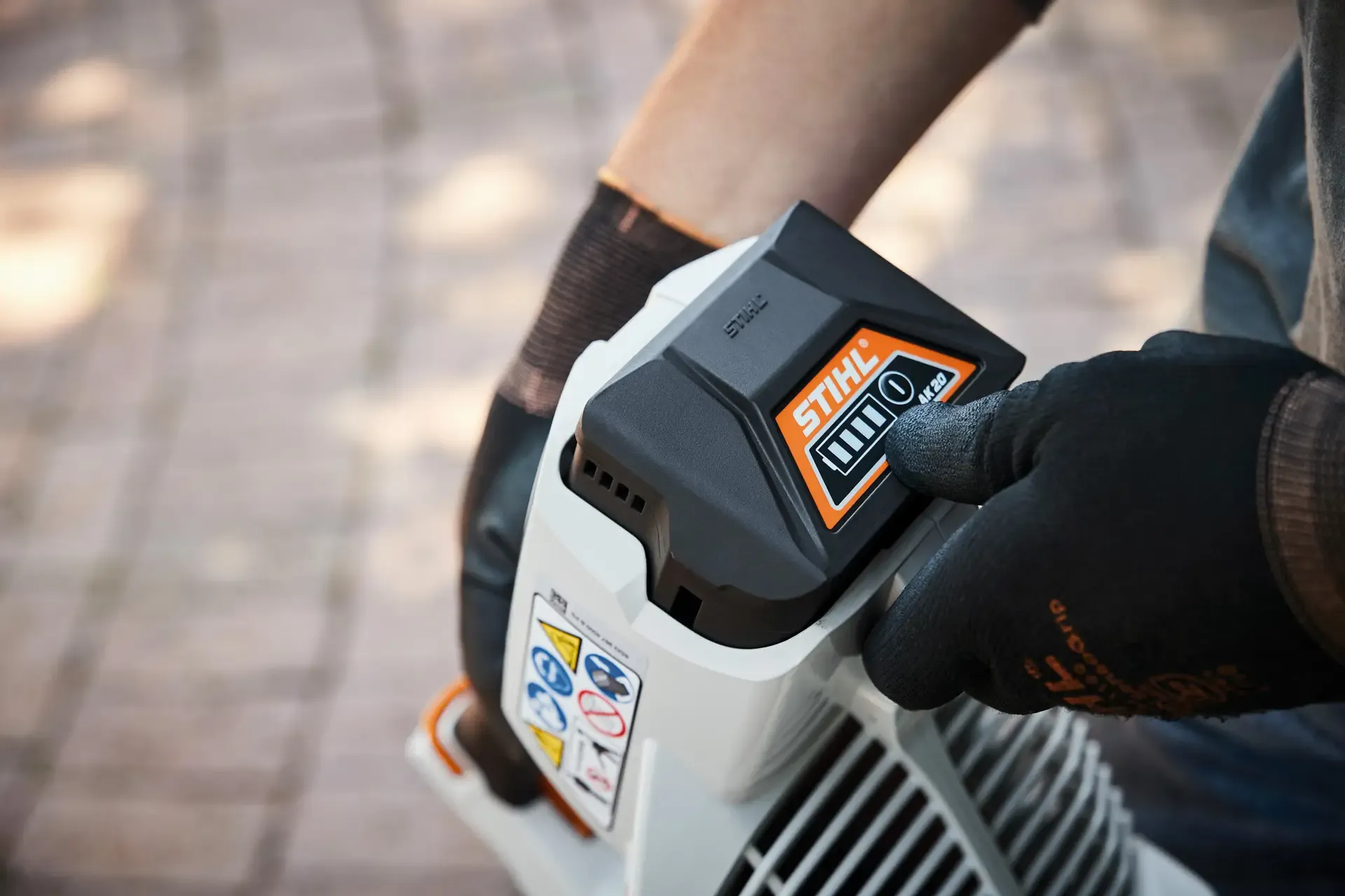 Battery-powered outdoor tools being properly stored and maintained